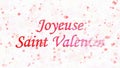 Happy Valentine's Day text in French Joyeuse Saint Valentin turns to dust from right on light background Royalty Free Stock Photo