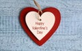 Happy Valentine`s Day.Two wooden hearts on on a blue background.St.Valentine Day greeting card.Love,romantic or wedding concept. Royalty Free Stock Photo