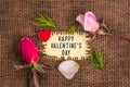 Happy valentine`s day written in hole on the burlap