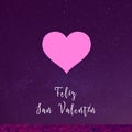 Happy Valentine\'s Day written in spanish with a big pink heart on starry purple background