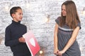 Happy Valentine's Day. Young boy giving a heart picture to his girlfriend Royalty Free Stock Photo