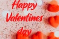 Happy valentine's day text on blurry Pink Background with Hearts. Royalty Free Stock Photo