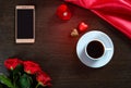 Happy Valentines Day background with wedding ring, rose flowers, smartphone, cup of coffee and chocolate candy Royalty Free Stock Photo