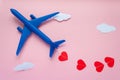 Happy Valentines day. Children`s plane on a pink background with red heart Royalty Free Stock Photo