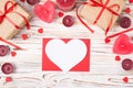 Happy Valentines day concept. Overhead close up view photo of romantic composition candles pins wrapped presents and post card in Royalty Free Stock Photo