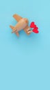 Happy Valentines day. Eco wooden children`s plane on a blue background with red heart Royalty Free Stock Photo