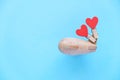 Happy Valentines day. Eco wooden children`s plane on a blue background with red heart Royalty Free Stock Photo