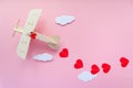 Happy Valentines day. wooden children`s plane on a pink background with red heart, and garland in the shape of a heart Royalty Free Stock Photo