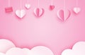 Happy valentines day greeting cards with paper hearts hanging on pink pastel background