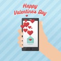 Happy valentines day with hand holding smartphone Royalty Free Stock Photo