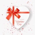 Happy Valentines Day! Heart shaped white Gift Box tied with Red Ribbons with a Bow on white background with Heart Shaped Confetti Royalty Free Stock Photo