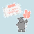 Happy Valentines Day lettering text on piece of paper under washi tape. Gray cartoon hippo holds pink gas balloons for some