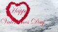Happy Valentines Day with lovely red outline shape of heart on natural marble stone background plus text Royalty Free Stock Photo