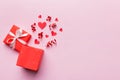 Happy valentines day opened heart shape gift box with small hearts, on colored background, valentines day card - top Royalty Free Stock Photo