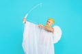 Happy Valentines Day. Serious bearded man in angel costume with bow and arrows. Valentines day cupid angel shooting Royalty Free Stock Photo