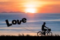 Happy Valentines Day, silhouette man bike at twilight sunset sky Royalty Free Stock Photo