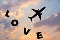 Happy Valentines Day, silhouette plane fly at twilight sunset sky with word love Royalty Free Stock Photo