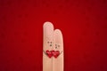 Happy valentines day. St.Valentine`s Day concept with finger art happy couple hugging on bright red background. A happy