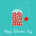 Happy Valentines Day. Teabag with red heart set inside. Love greeting card. Teabag packaging with label icon. Top wiew. Flat