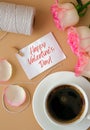 HAPPY VALENTINES DAY text Tender pink rose with white cup of coffee on beige background. Romantic pastel pink rose Royalty Free Stock Photo