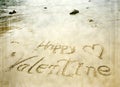 Happy Valentines day! written in sand Royalty Free Stock Photo