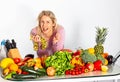 Portrait of blonde long-haired happy woman with Heap Of Vegetables. Isolated. Royalty Free Stock Photo