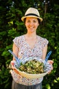 Happy vegetarian woman with salad