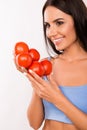 Happy vegetarin woman with tomatoes Royalty Free Stock Photo
