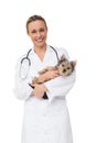 Happy vet holding yorkshire terrier puppy smiling at camera Royalty Free Stock Photo