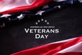 Happy Veterans Day. American flags veterans against a blackboard background Royalty Free Stock Photo