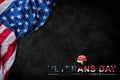 Happy Veterans Day. American flags with the text thank you veterans against a blackboard background. Royalty Free Stock Photo