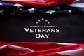 Happy Veterans Day. American flags with the text thank you veterans against a blackboard background. November 11 Royalty Free Stock Photo