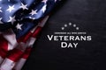 Happy Veterans Day. American flags with the text thank you veterans against a blackboard background. November 11 Royalty Free Stock Photo