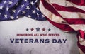 Happy Veterans Day concept. American flags against a white stone  background. November 11 Royalty Free Stock Photo