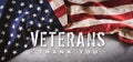 Happy Veterans Day concept. American flags and the text against dark stone background. November 11 Royalty Free Stock Photo