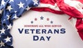 Happy Veterans Day concept made from American flags and the text against white background. November 11 Royalty Free Stock Photo
