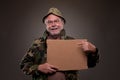 Happy Vietnam Veteran showing a cardboard piece Royalty Free Stock Photo