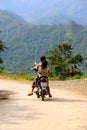 Happy Vietnamese children playing on motorbike Royalty Free Stock Photo