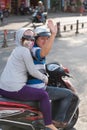 Happy Vietnamese couple on motorcycle