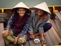 Happy Vietnamese Couple sitting in boat