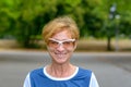 Happy vivacious woman in trendy modern glasses Royalty Free Stock Photo