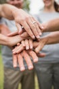 Happy volunteer family putting their hands together Royalty Free Stock Photo