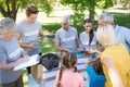 Happy volunteer family separating donations stuffs Royalty Free Stock Photo
