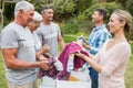 Happy volunteer family separating donations stuffs Royalty Free Stock Photo