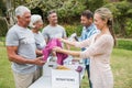 Happy volunteer family separating donations stuffs Royalty Free Stock Photo