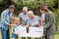 Happy volunteer family separating donations stuffs Royalty Free Stock Photo