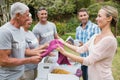 Happy volunteer family separating donations stuffs Royalty Free Stock Photo