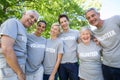 Happy volunteer family smiling at the camera