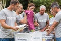 Happy volunteer looking at donation box Royalty Free Stock Photo