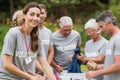 Happy volunteer looking at donation box Royalty Free Stock Photo